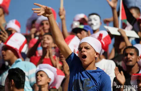 Palestinian fans attend the first leg football match of the Palestine Cup final between Hilal al-Quds football club and Shabab Khan Younis football club at the Palestine Stadium in Gaza City on June 20, 2018. Photo by Ma...
