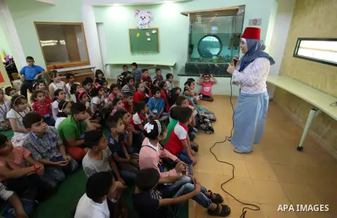 Palestinian children enjoy as part of the activities during a summer holiday, at Qattan Foundation in Gaza city, on June 21, 2018. Photo by Mahmoud Ajour