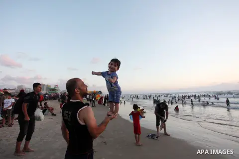 Palestinians enjoy their time at the sea coast of Gaza City June 29, 2018. Photo by Mahmoud Ajour