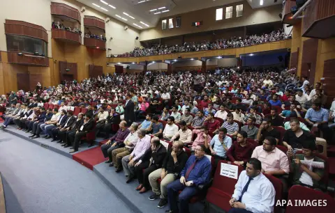 Qatar's Ambassador to the Palestinian Authority, Mohammed Al Emadi attends the ceremony of provide a grant to support the fees of Palestinian needy students at Islamic University, in Gaza city on June 30, 2018. Photo by...