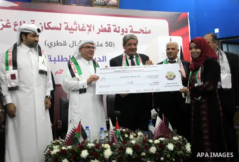 Qatar's Ambassador to the Palestinian Authority, Mohammed Al Emadi attends the ceremony of provide a grant to support the fees of Palestinian needy students at Al-Aqsa University, in Gaza city on June 30, 2018. Photo by...