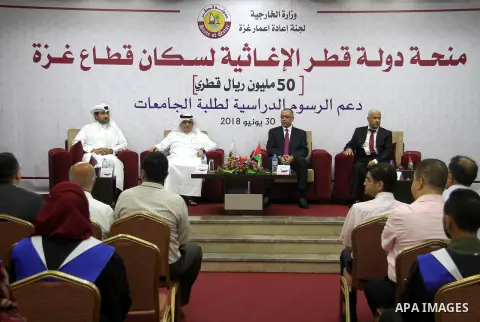Qatar's Ambassador to the Palestinian Authority, Mohammed Al Emadi attends the ceremony of provide a grant to support the fees of Palestinian needy students at University College of Applied Sciences, in Gaza city on June...