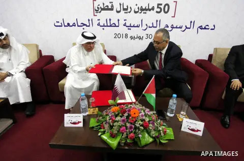 Qatar's Ambassador to the Palestinian Authority, Mohammed Al Emadi attends the ceremony of provide a grant to support the fees of Palestinian needy students at University College of Applied Sciences, in Gaza city on June...
