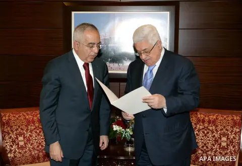 (FILES) This file photo taken on February 14, 2011 shows Palestinian Prime Minister Salam Fayyad as he submits his government's resignation to Palestinian President Mahmoud Abbas in Abbas' offices in the West Bank town o...
