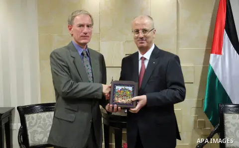 Palestinian Prime Minister Rami Hamdallah, representative of Germany to Palestine Peter Perverth, in the West Bank city of Ramallah on July 2, 2018. Photo by Prime Minister Office