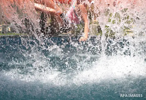 Palestinians swim in the water city "Safari Aqua Park" during the summer holiday, in the West Bank city of Jericho, on July 2, 2018. Photo by Shadi Hatem