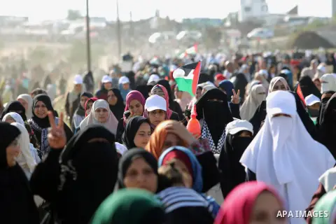 Palestinian women gather during a protest where Palestinians demand the right to return to their homeland along the border with Israel east of Gaza City on July 3, 2018. Photo by Atia Darwish