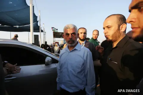 Hamas's leader in the Gaza Strip Yahya Sinwar participates during a protest by Palestinian women where Palestinians demand the right to return to their homeland along the border with Israel east of Gaza City on July 3, 2...