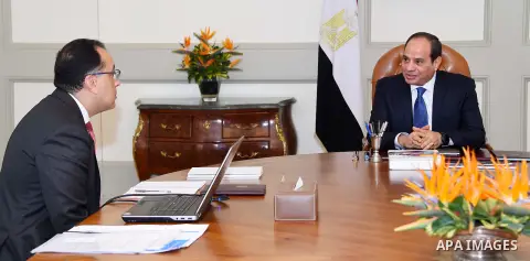Egyptian President Abdel Fattah al-Sisi meets with Mustafa Madbouli, Prime Minister in Cairo, Egypt on July 4, 2018. Photo by Egyptian President Office