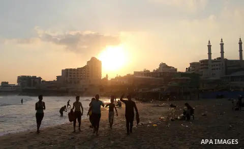 Palestinians enjoy their time at the sea coast of Gaza City, July 06, 2018. Photo by Mahmoud Ajour