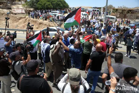 Palestinian protesters take part during a protest against Israel at the Palestinian Bedouin village of Khan al-Ahmar, east of Jerusalem in the occupied West Bank on July 6, 2018. Israel's Supreme Court has temporarily bl...