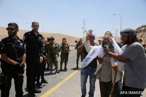Palestinian protesters take part during a protest against Israel at the Palestinian Bedouin village of Khan al-Ahmar, east of Jerusalem in the occupied West Bank on July 6, 2018. Israel's Supreme Court has temporarily bl...