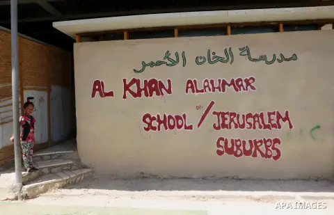 A Palestinian girl stands outside Khan al-Ahmar's school at the Palestinian Bedouin village of Khan al-Ahmar, east of Jerusalem in the occupied West Bank on July 6, 2018. Israel's Supreme Court has temporarily blocked th...