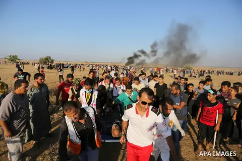 A wounded Palestinian protester is evacuated during clashes with Israeli troops in tents protest where Palestinian demand the right to return to their homeland at the Israel-Gaza border, in Khan Younis in the southern Ga...