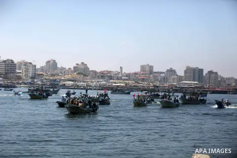 Palestinian activists ride fishing boats sails towards Europe aiming to break Israel's blockade on Gaza, at the sea in Gaza, on July 10, 2018. The Gaza Strip has been under Israeli blockade since 2007. Photo by Ashraf Am...