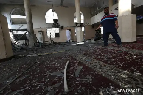 Palestinians inspect a mosque that was damaged in an Israeli airstrike on the Gaza City, on July 15, 2018. Israel's military said it had launched air strikes targeting Hamas in the Gaza Strip on July 14, as rockets and m...