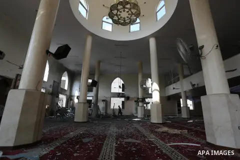 Palestinians inspect a mosque that was damaged in an Israeli airstrike on the Gaza City, on July 15, 2018. Israel's military said it had launched air strikes targeting Hamas in the Gaza Strip on July 14, as rockets and m...