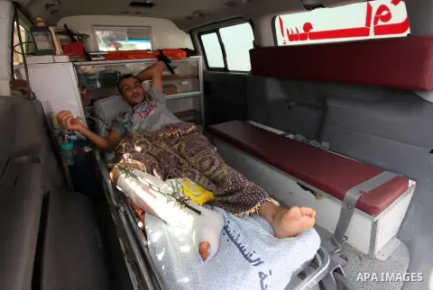 Palestinians who were wounded by Israeli troops during clashes at Israeli-Gaza border, take part in a protest to demand their rights to travel for treatment and against the siege on the Gaza Strip, at Erez crossing, in t...