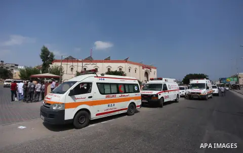 Palestinian ambulance drivers take part in a protest against the siege on the Gaza Strip, outside Indonesian hospital, in the northern of Gaza Strip on July 17, 2018. Photo by Mahmoud Ajour