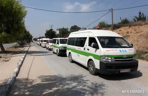 Palestinian ambulance drivers take part in a protest against the siege on the Gaza Strip, outside Indonesian hospital, in the northern of Gaza Strip on July 17, 2018. Photo by Mahmoud Ajour