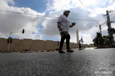 Palestinians take part in the challenge of walking, under the title: "Challenge your age" in the West Bank city of Ramallah, on July 20, 2018. Photo by Shadi Hatem