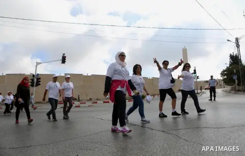 Palestinians take part in the challenge of walking, under the title: "Challenge your age" in the West Bank city of Ramallah, on July 20, 2018. Photo by Shadi Hatem