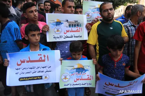 Palestinian supporters of Islamic Jihad movement take part during a protest to show solidarity with Al-Aqsa mosque, in Gaza city, on July 23, 2018. Photo by Dawoud Abo Alkas