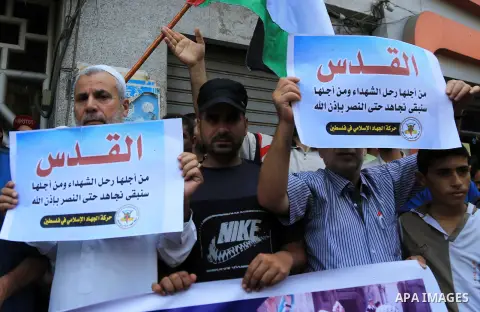 Palestinian supporters of Islamic Jihad movement take part during a protest to show solidarity with Al-Aqsa mosque, in Gaza city, on July 23, 2018. Photo by Dawoud Abo Alkas