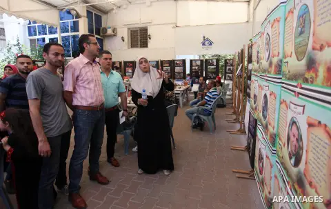 Palestinians attend an exhibition for the "Great Return March", in Gaza City on July 24, 2018. Photo by Mahmoud Ajour