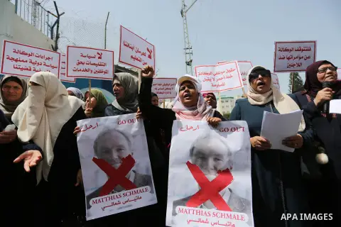 Palestinian employees of United Nations Relief and Works Agency (UNRWA) take part in a protest against jobs termination by UNRWA outside its headquarters in Gaza City, on July 25, 2018. Photo by Ashraf Amra
