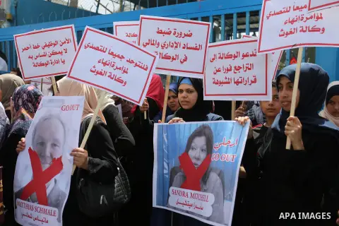 Palestinian employees of United Nations Relief and Works Agency (UNRWA) take part in a protest against jobs termination by UNRWA outside its headquarters in Gaza City, on July 25, 2018. Photo by Ashraf Amra