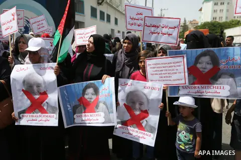 Palestinian employees of United Nations Relief and Works Agency (UNRWA) take part in a protest against jobs termination by UNRWA outside its headquarters in Gaza City, on July 25, 2018. Photo by Ashraf Amra