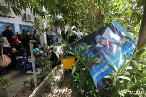 Palestinian employees of United Nations Relief and Works Agency (UNRWA) take part in a protest against jobs termination by UNRWA outside its headquarters in Gaza City, on July 25, 2018. Photo by Ashraf Amra