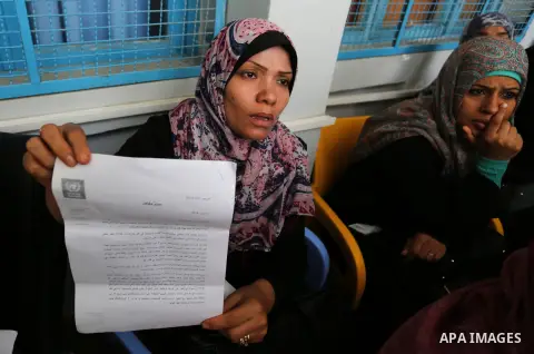 Palestinian employees of United Nations Relief and Works Agency (UNRWA) take part in a protest against jobs termination by UNRWA outside its headquarters in Gaza City, on July 25, 2018. Photo by Ashraf Amra