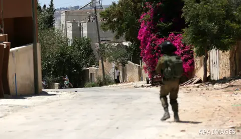 Israeli security forces take position during clashes with Palestinian protesters following a demonstration against the expropriation of Palestinian land by Israel in the village of Kfar Qaddum, near Nablus, in the occupi...