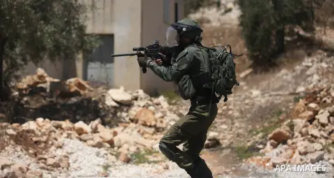 Israeli security forces take position during clashes with Palestinian protesters following a demonstration against the expropriation of Palestinian land by Israel in the village of Kfar Qaddum, near Nablus, in the occupi...