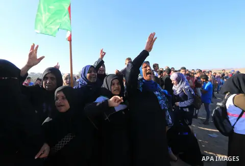 Palestinian protesters gather during clashes with Israeli troops in tents protest where Palestinian demand the right to return to their homeland at the Israel-Gaza border, in al-Bureij in the center of Gaza Strip on July...