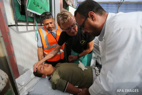 Injured Palestinian protestors receive treatment at a medical tent during clashes with Israeli security forces in tents protest where Palestinian demand the right to return to their homeland at the Israel-Gaza border, in...