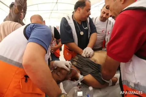 Injured Palestinian protestors receive treatment at a medical tent during clashes with Israeli security forces in tents protest where Palestinian demand the right to return to their homeland at the Israel-Gaza border, in...