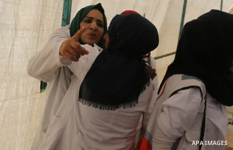 A Palestinian nurse reacts upon seeing the body of her husband who was killed by Israeli troops during clashes in tents protest where Palestinian demand the right to return to their homeland at the Israel-Gaza border, in...