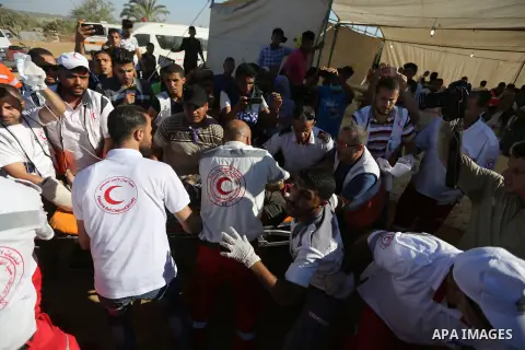 Injured Palestinian protestors receive treatment at a medical tent during clashes with Israeli security forces in tents protest where Palestinian demand the right to return to their homeland at the Israel-Gaza border, in...