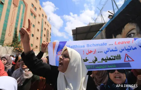 Palestinian employees of United Nations Relief and Works Agency (UNRWA) take part in a protest against job cuts announced by the agency outside its offices in Gaza City on July 29, 2018. Photo by Mahmoud Khattab