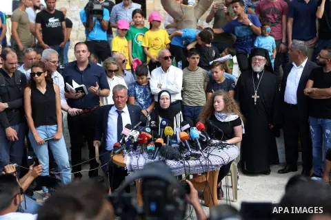 Palestinian activist and campaigner Ahed Tamimi and her mother hold a press conference in the West Bank village of Nabi Saleh near Ramallah on July 29, 2018, upon her release from prison after an eight-month sentence for...