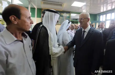 Palestinian Prime Minister Rami Hamdallah opens departments in Hebron hospitals, in the West Bank city of Hebron, on Aug. 01, 2018. Photo by Prime Minister Office
