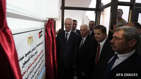 Palestinian Prime Minister Rami Hamdallah opens departments in Hebron hospitals, in the West Bank city of Hebron, on Aug. 01, 2018. Photo by Prime Minister Office