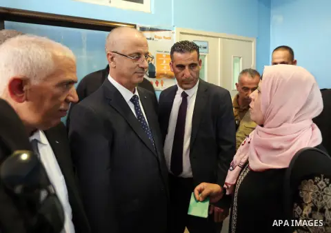 Palestinian Prime Minister Rami Hamdallah opens departments in Hebron hospitals, in the West Bank city of Hebron, on Aug. 01, 2018. Photo by Prime Minister Office