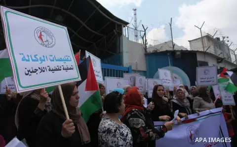Palestinian employees of United Nations Relief and Works Agency (UNRWA) take part in a protest against a U.S. decision to cut aid, outside its offices, in Gaza City, on Aug. 02 2018. Photo by Mahmoud Ajour