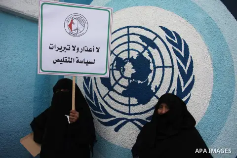 Palestinian employees of United Nations Relief and Works Agency (UNRWA) take part in a protest against a U.S. decision to cut aid, outside its offices, in Gaza City, on Aug. 02 2018. Photo by Mahmoud Ajour