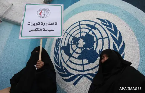 Palestinian employees of United Nations Relief and Works Agency (UNRWA) take part in a protest against a U.S. decision to cut aid, outside its offices, in Gaza City, on Aug. 02 2018. Photo by Mahmoud Ajour