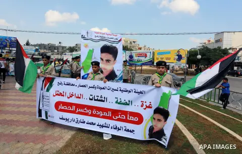 Palestinian scouts take part in a march "The Great Return March", in Rafah in the southern of Gaza strip, on Aug. 02, 2018. Photo by Abed Rahim Khatib
